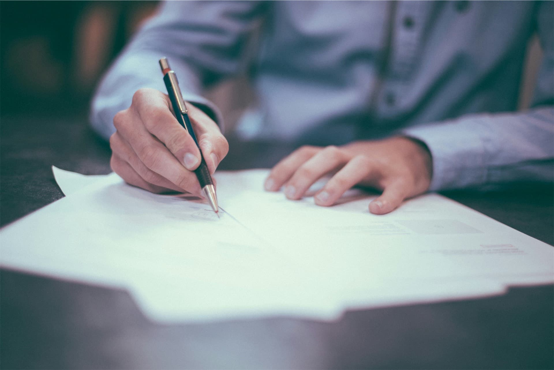 Legal documents and pen representing Claim Forms for small debt claims